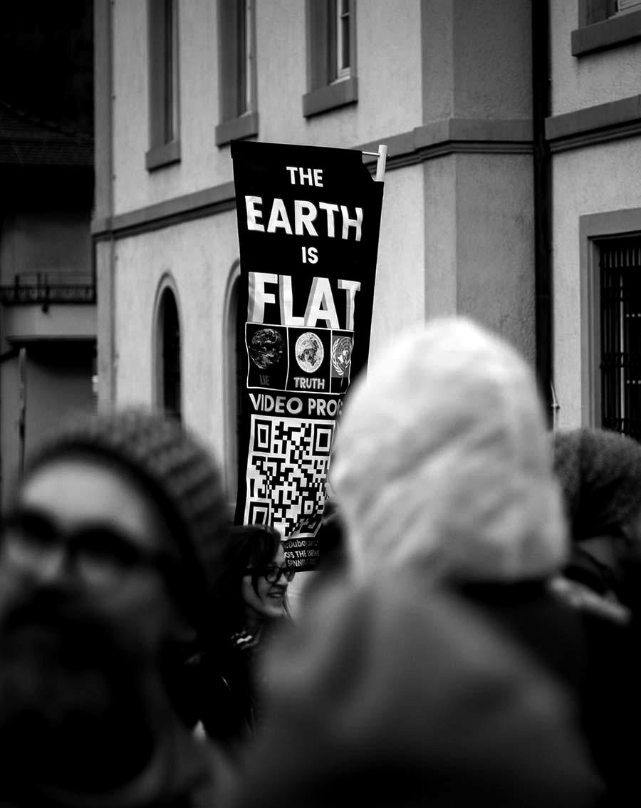 Contemporary flat-earth protest signage