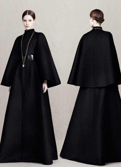 Two robed figures seen from behind