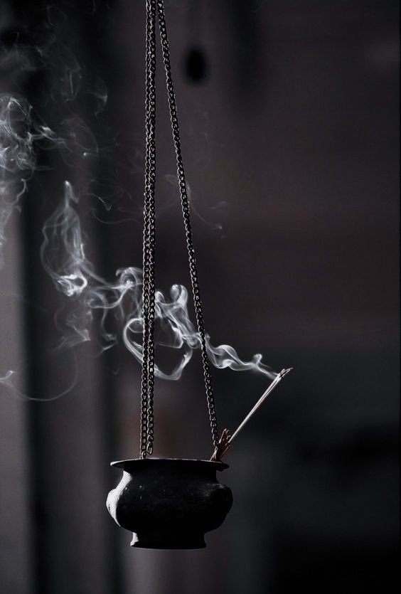 Incense burner with rising smoke