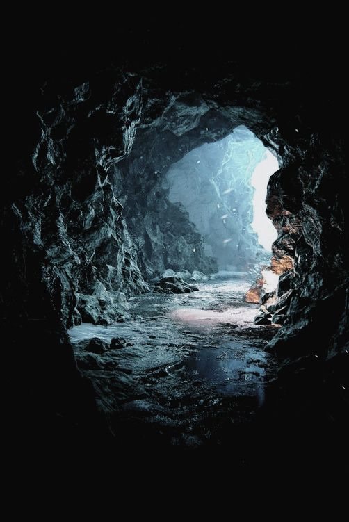 Light entering a dark stone cave