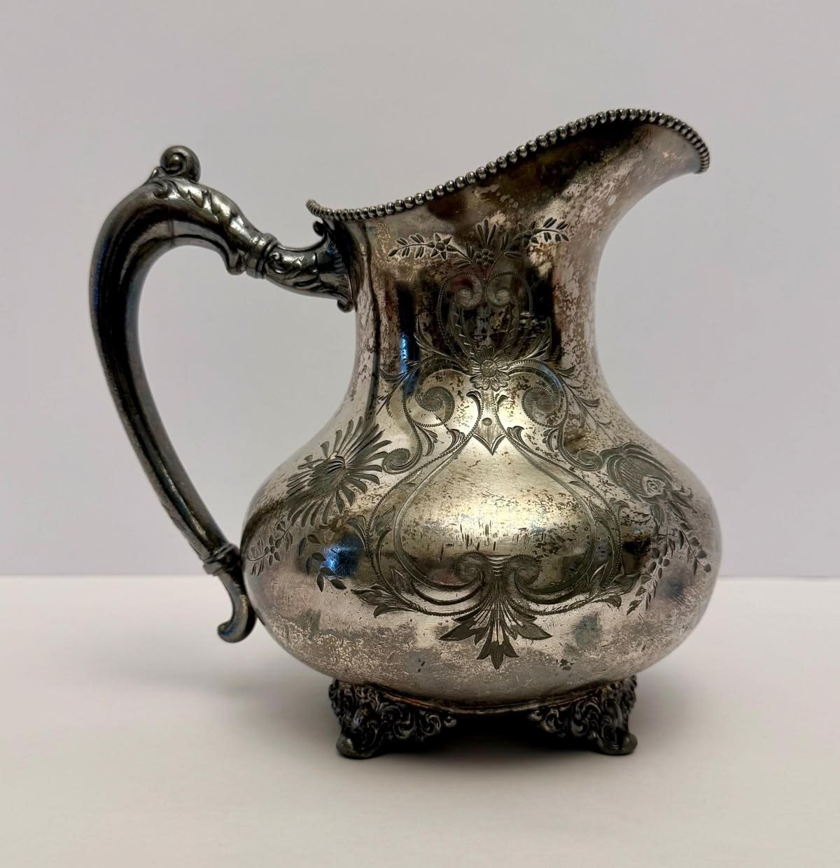 Ornate silver pitcher